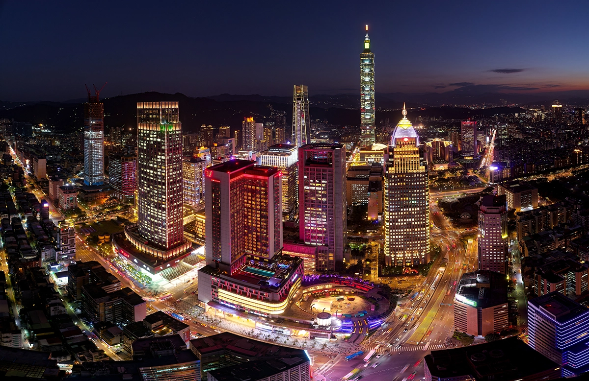 Taipei 101 and the Taipei skyline in Taiwan at night, a key market in many Emerging Markets ETFs.