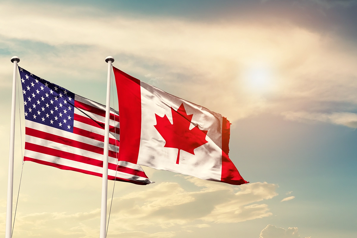 Flags of the USA and Canada, the two countries that make up North America ETFs.